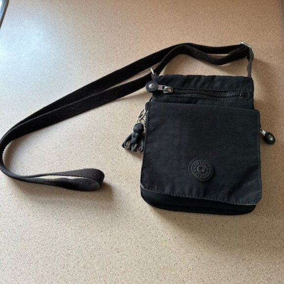 Kipling Handbags - Cute Kipling Black Nylon Cross over purse